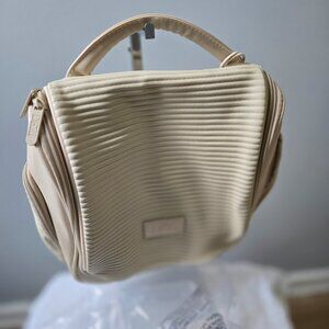 P332. DEZI  Ivory Travel Toiletries Bag  NWT
